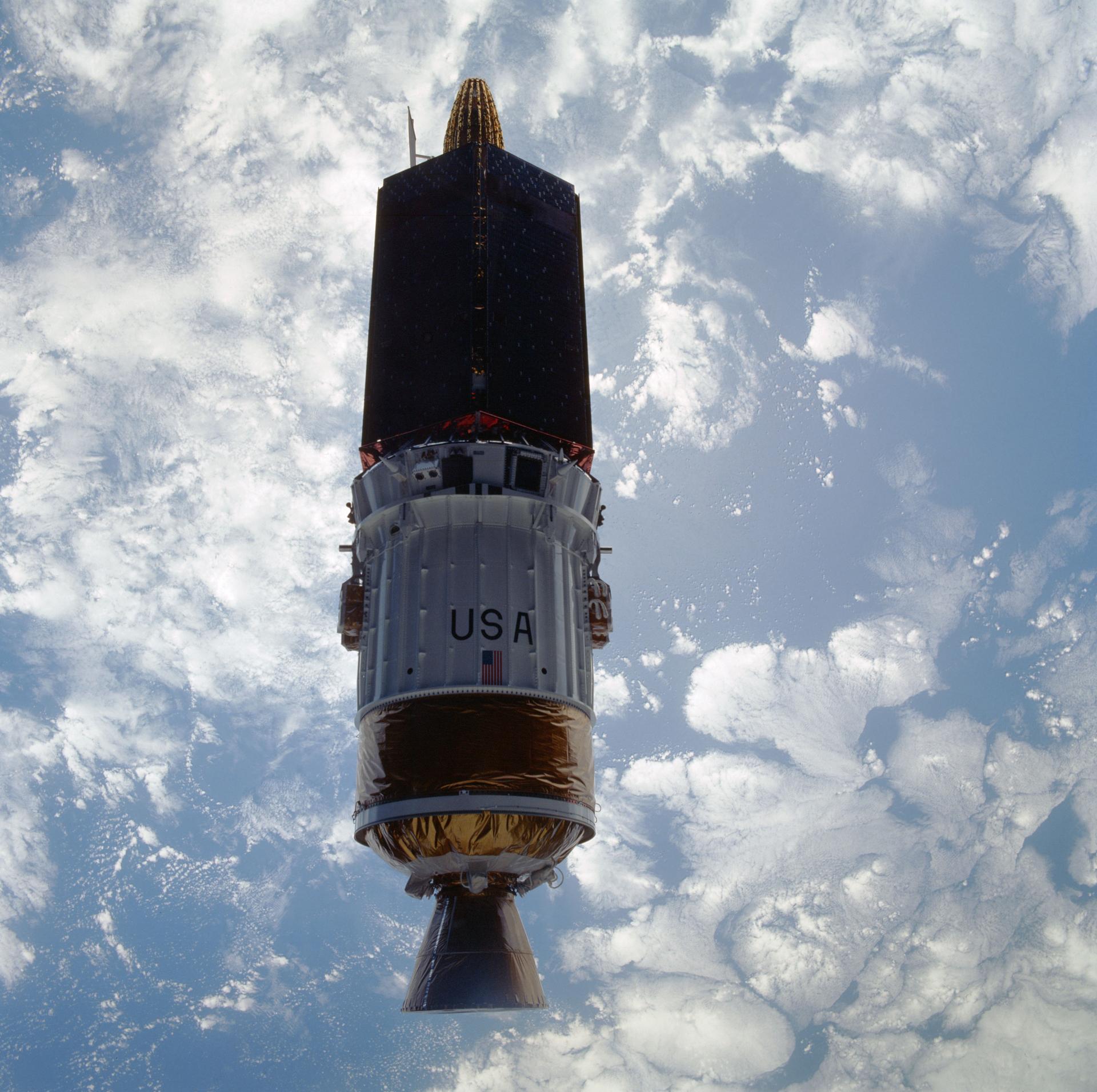 A Tracking and Data Relay Satellite with its Inertial Upper Stage above the Pacific Ocean after deployment from Space Shuttle Atlantis